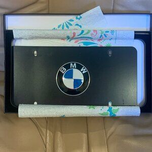BLACK 12" X 6" FRONT PLATE WITH BMW BADGE, LOGO, USED